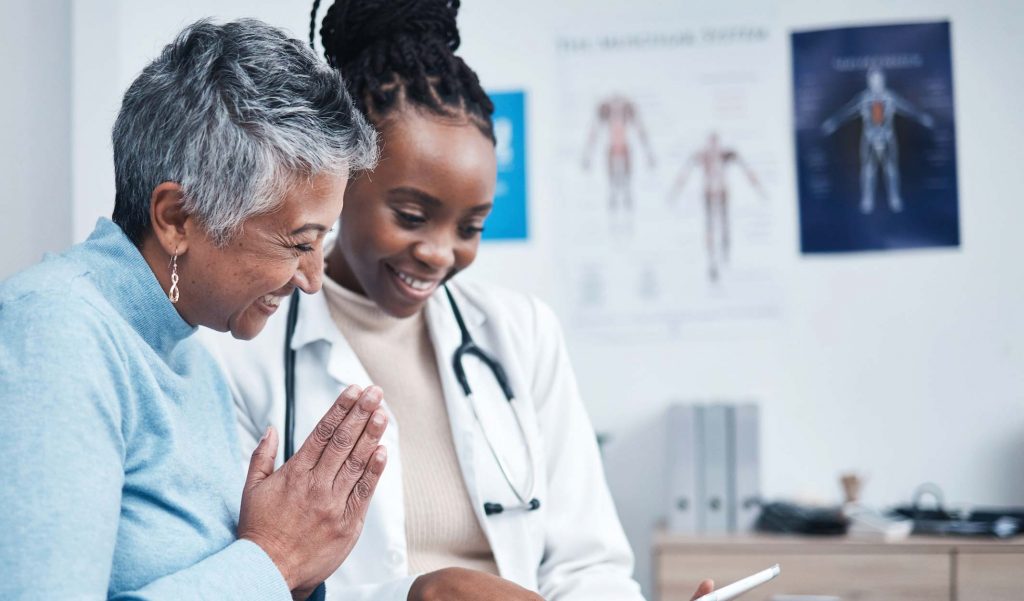 Patient consulting with healthcare professional.