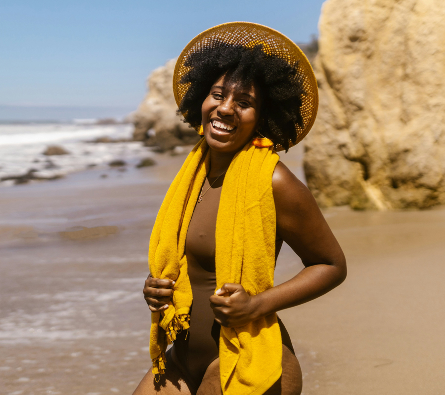 Woman in yellow at beach