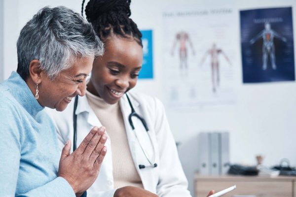 Patient consulting with healthcare professional.