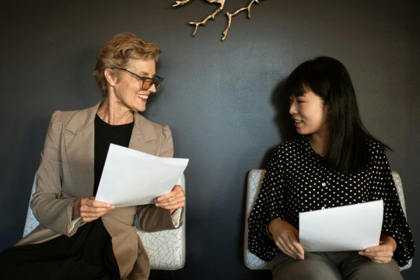 Two Women Going Over Papers