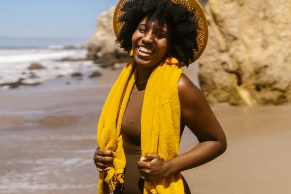 Woman in yellow at beach